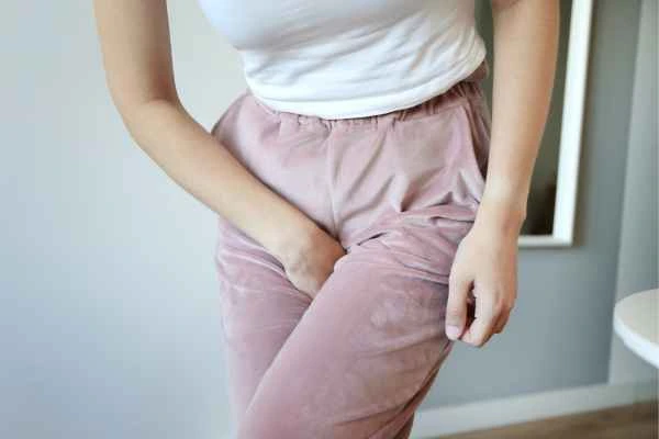 woman running for the toilet because of urinary incontinence Cambridgeshire